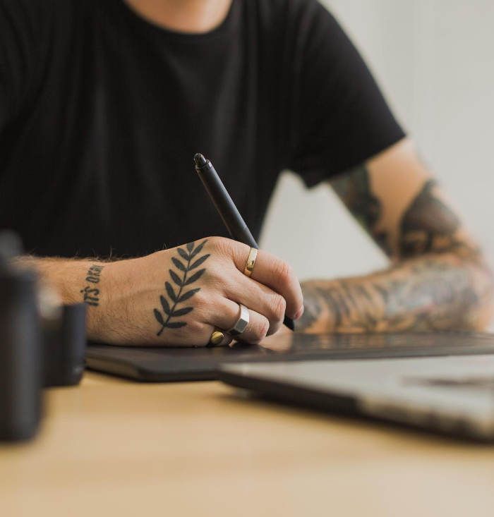 Designer sketching a Shopify store redesign